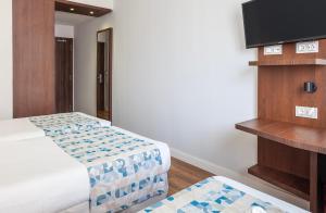 TV a/nebo společenská místnost v ubytování Hotel Olympia Universidades