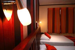Postel nebo postele na pokoji v ubytování Oak Ray Colombo City Hotel