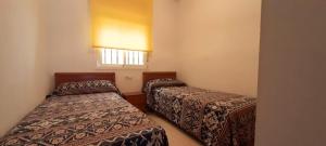 Ein Bett oder Betten in einem Zimmer der Unterkunft Costa Caribe II Nº 1028