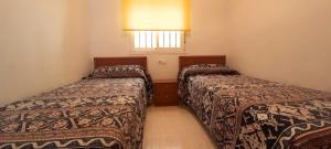 Ein Bett oder Betten in einem Zimmer der Unterkunft Costa Caribe II Nº 1028