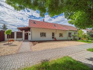 a white house with a red roof at Apartmány Lenkoska in Nový Přerov