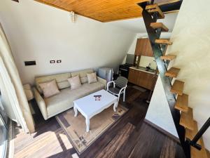 Posezení v ubytování Arditi's Chalets