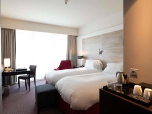 Postel nebo postele na pokoji v ubytování Sofitel Brussels Europe