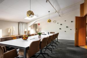 a conference room with a long table and chairs at Best Western Plus Sthlm Bromma in Stockholm