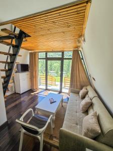 Posezení v ubytování Arditi's Chalets
