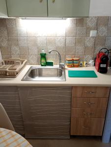 a kitchen with a sink and a counter top at Gaios Rest Apartment Central Gaios Stay Walk Everywhere in Gaios