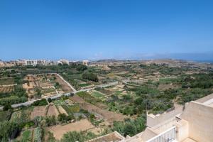 a view of a city from the top of a building at Luxury Apartment Valley Views A8 in Xagħra +2 photos