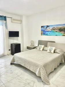 Postel nebo postele na pokoji v ubytování B&B I Colori Dell'Isola