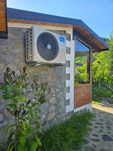 a fan on the side of a building at Guesthouse Lika 