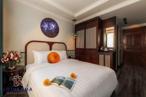 Voodi või voodid majutusasutuse Lotusama Central Hanoi Hotel toas
