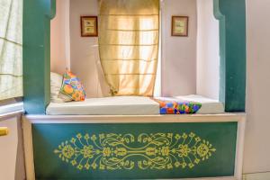 Postel nebo postele na pokoji v ubytování FabHotel The Rajmani