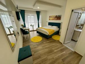 Postel nebo postele na pokoji v ubytování Kangaroo Apartmani