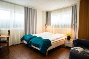 Postel nebo postele na pokoji v ubytování Fridas Hotell