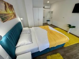 Postel nebo postele na pokoji v ubytování Kangaroo Apartmani