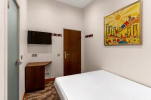 TV a/nebo společenská místnost v ubytování Rixwell Collection Seaside Hotel Jurmala