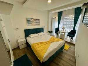 Postel nebo postele na pokoji v ubytování Kangaroo Apartmani