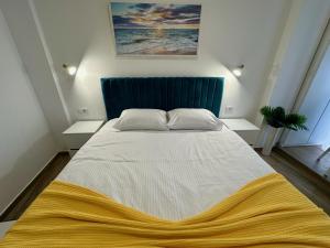 Postel nebo postele na pokoji v ubytování Kangaroo Apartmani