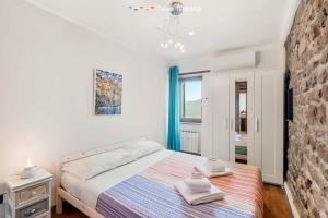 Una cama o camas en una habitación de Laya Marina, Terre Marine