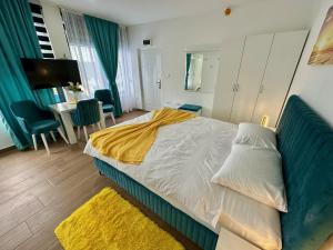 Postel nebo postele na pokoji v ubytování Kangaroo Apartmani