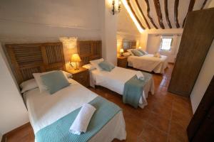 En eller flere senge i et værelse på Villasecre Casa Rural + 67 billeder