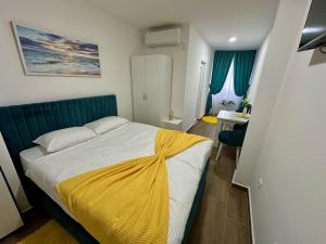Postel nebo postele na pokoji v ubytování Kangaroo Apartmani