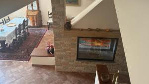 an overhead view of a living room with a fireplace at Linda's Retreat in Fiano Romano