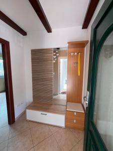 a room with a closet with a mirror and a door at Test in Koper