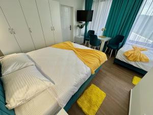 Postel nebo postele na pokoji v ubytování Kangaroo Apartmani