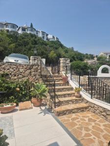 a set of stairs with potted plants on them at Casa Linda in Monte Pego