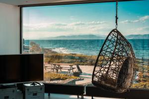 a room with a large view of the ocean at Horizon Luxury Seafront Villa in Vaia