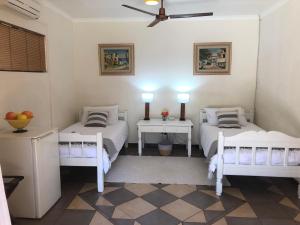 Katil atau katil-katil dalam bilik di Golf View Guest House