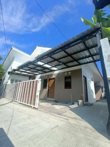 a building with a solarium on the side of it at Kamar Kost AC Mezanine in Gombong +12 photos