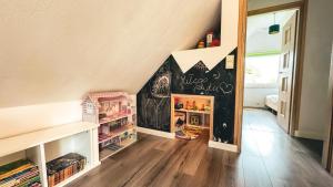 a room with a chalkboard in the corner of a room at Chatka Biesczadersko in Lutowiska