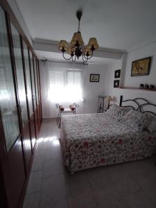 a bedroom with a bed and a window at valenia city in Valencia