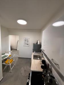 a kitchen with a sink and a counter top at Summer Project Theros in Nea Kalikratia +53 photos