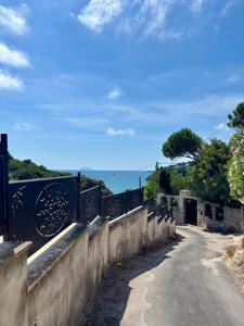 a bridge over a road with a view of the ocean at Acquamarina in Gaeta