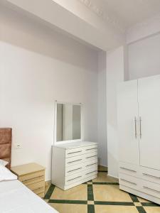 Postel nebo postele na pokoji v ubytování LM Murati Hotel