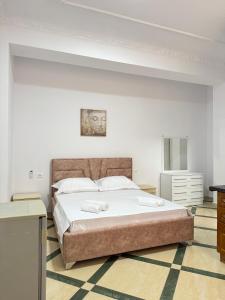 Postel nebo postele na pokoji v ubytování LM Murati Hotel
