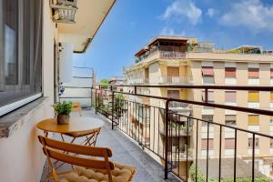 a balcony with a table and a chair at Your dream in Rome San Paolo in Rome