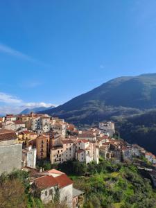 a town on a hill with mountains in the background at Il Ricordo Ritrovato in Rivello