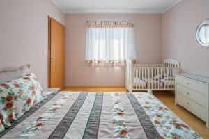 Postel nebo postele na pokoji v ubytování Vila Vita
