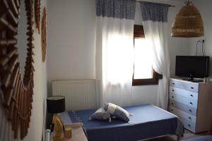 Postel nebo postele na pokoji v ubytování Platamon Boho Apartment- Με θέα την θάλασσα