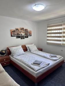 Posteľ alebo postele v izbe v ubytovaní ApHEARTments + 23 fotografií