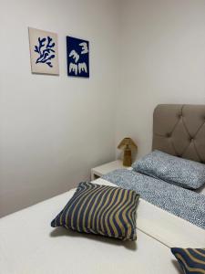 a bedroom with a bed with a pillow on it at Zio Nino in Sutomišćica