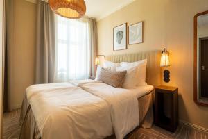 Postel nebo postele na pokoji v ubytování NH Copenhagen Grand Joanne