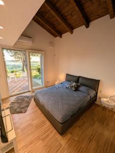 Ένα ή περισσότερα κρεβάτια σε δωμάτιο στο L'Oliveta