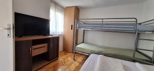Postel nebo postele na pokoji v ubytování LiMa Apartman Ház
