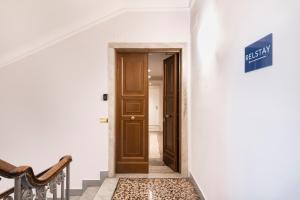 a hallway with a door in a house at RELSTAY - Assarotti Suites in Genoa
