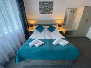 Postel nebo postele na pokoji v ubytování Hotel Felix