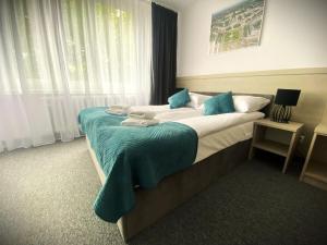 Postel nebo postele na pokoji v ubytování Hotel Felix